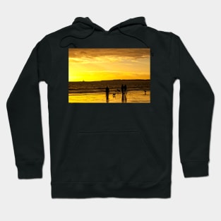 Dog walkers on the beach at sunrise Hoodie